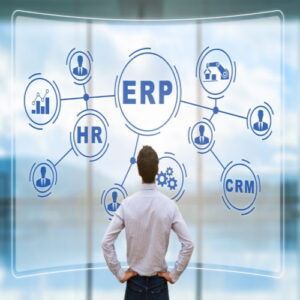 IT manager analyzing the architecture of ERP (Enterprise Resource Planning) system on virtual AR screen with connections between business intelligence (BI), production, HR and CRM modules